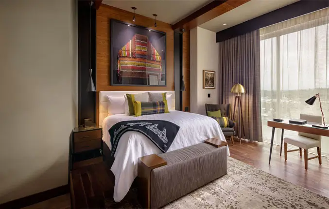 An image showcasing the bedroom of the Cascade Suite.