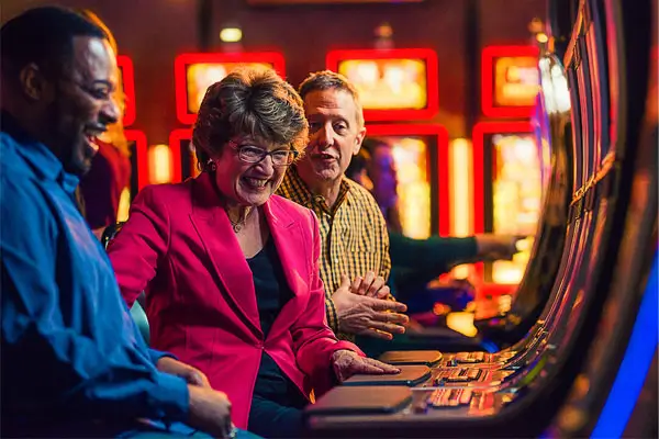 People playing at slot machines